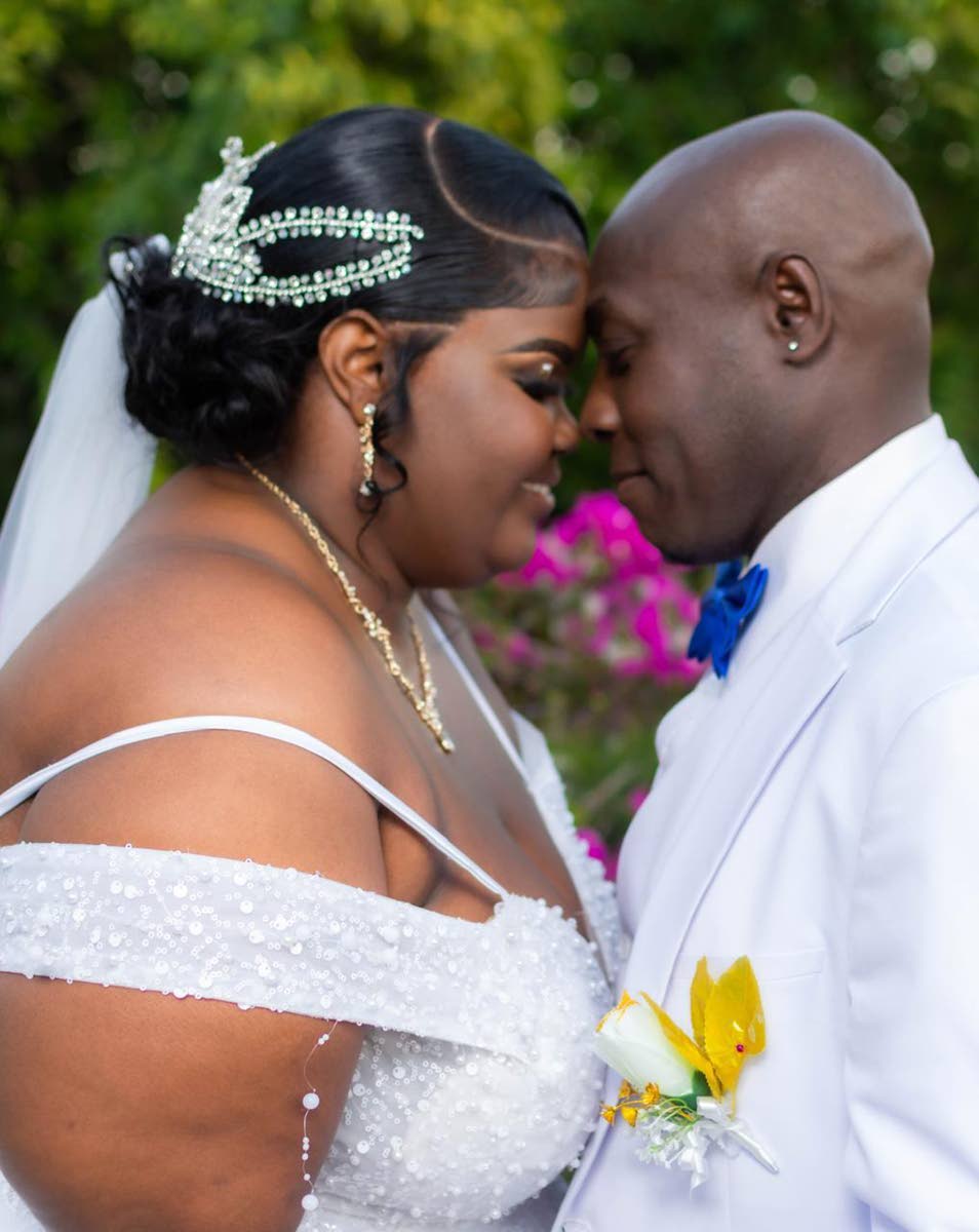 Keisha and Iswall share a quiet, intimate moment on their wedding day.