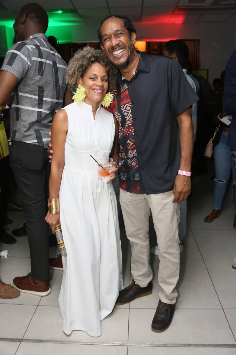 Opposition senators Dr Maziki Thame and Allan Bernard pair up for a quick photo opportunity.