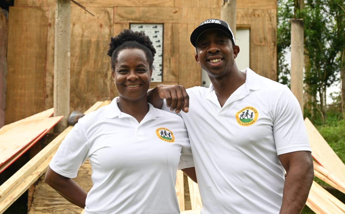 Andrea Pryce and her brother O’Neil Pryce during a donation of building materials to two residents in Bunkers Hill, Trelawny.