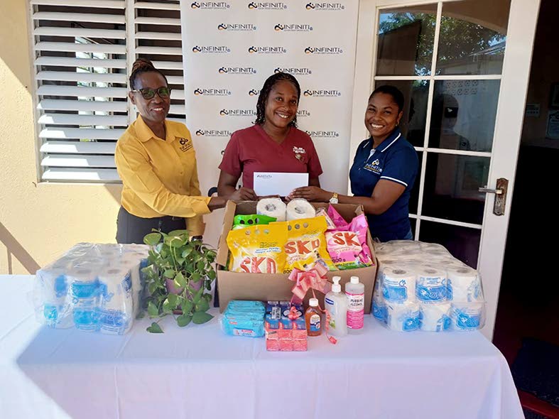 Infiniti Co-operative Credit Union staff members offer a $50,000 donation to representatives at the Hanover Infirmary, supporting residents through the Hope for the Holidays initiative.
