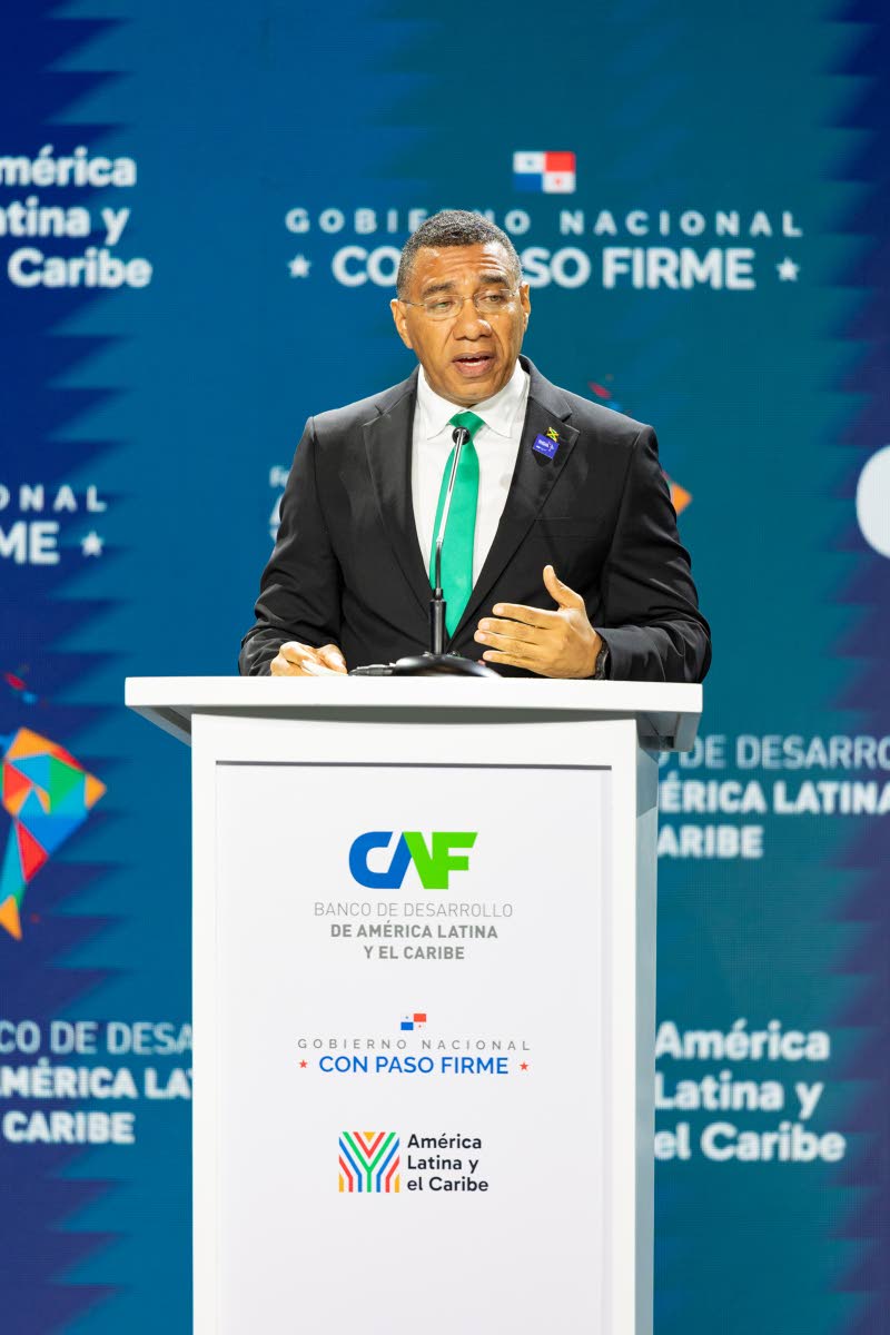 Prime Minister Dr Andrew Holness addressing day one of the plenary session of the CAF-International Economic Forum Latin America and the Caribbean 2026 in Panama City, Panama, yesterday.