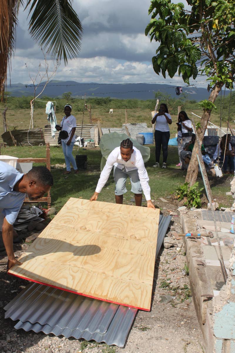 Agape Hope Foundation President Stephen Simpson and team members at a project site in Howells Content, Clarendon, where the group rebuilt sections of a home destroyed by Hurricane Melissa in October 2025.