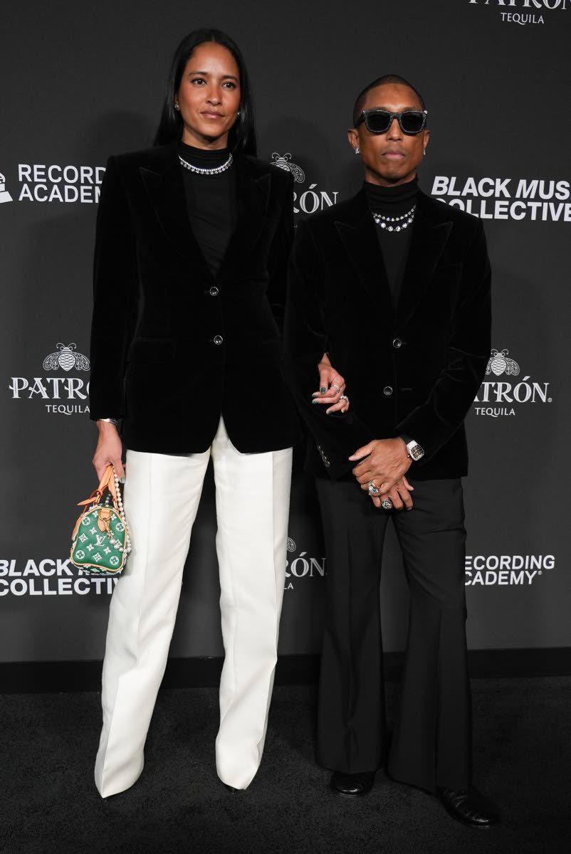 Helen Lasichanh (left) and Pharrell Williams attend the Recording Academy Honors presented by the Black Music Collective last Thursday, in Los Angeles. 