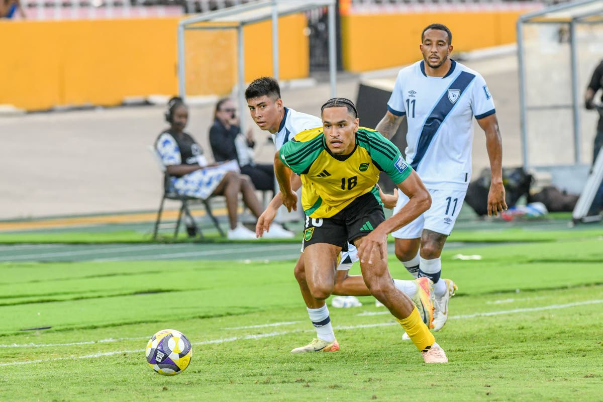 Jamaica’s Jon Russell (centre) leaves Guatemala’s Carlos Aguilar (left) and Nathaniel Mendez for dead during their Concacaf World Cup Qualifer inside the National Stadium on June 10, 2025. 