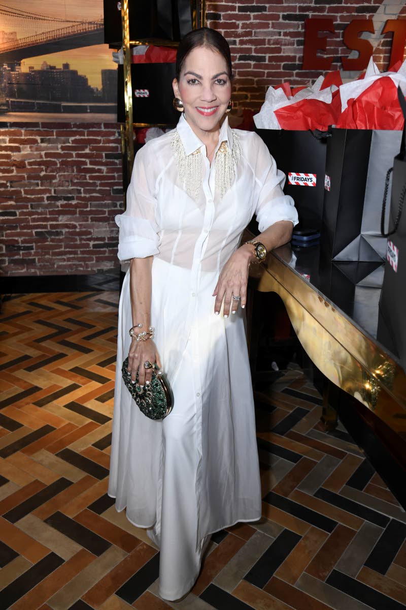 Ana Olivero adds a pop of colour to her all-white look with this eye-catching embellished minaudière clutch.