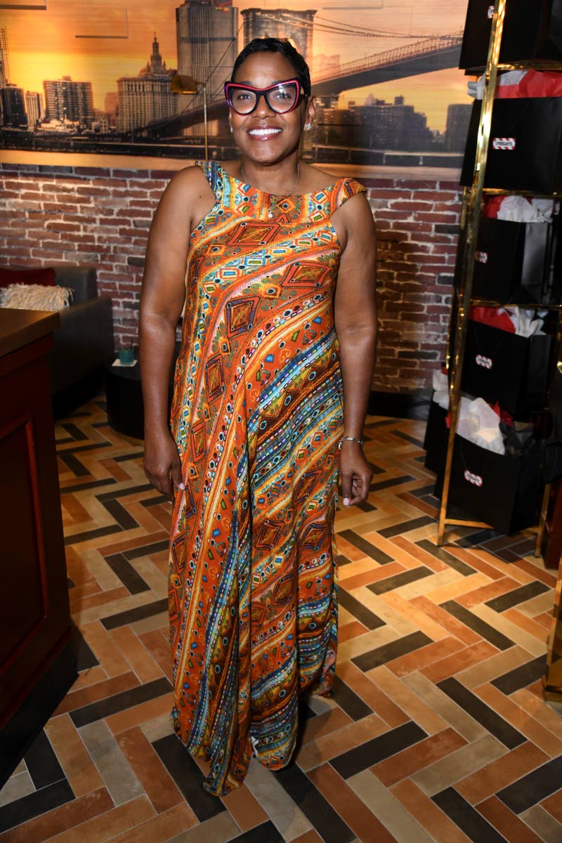 Marsha Burrell-Rose, marketing and public relations manager at Food for the Poor Jamaica, stuns in a vibrant, sleeveless maxi dress made locally, featuring a bold tribal-inspired print.