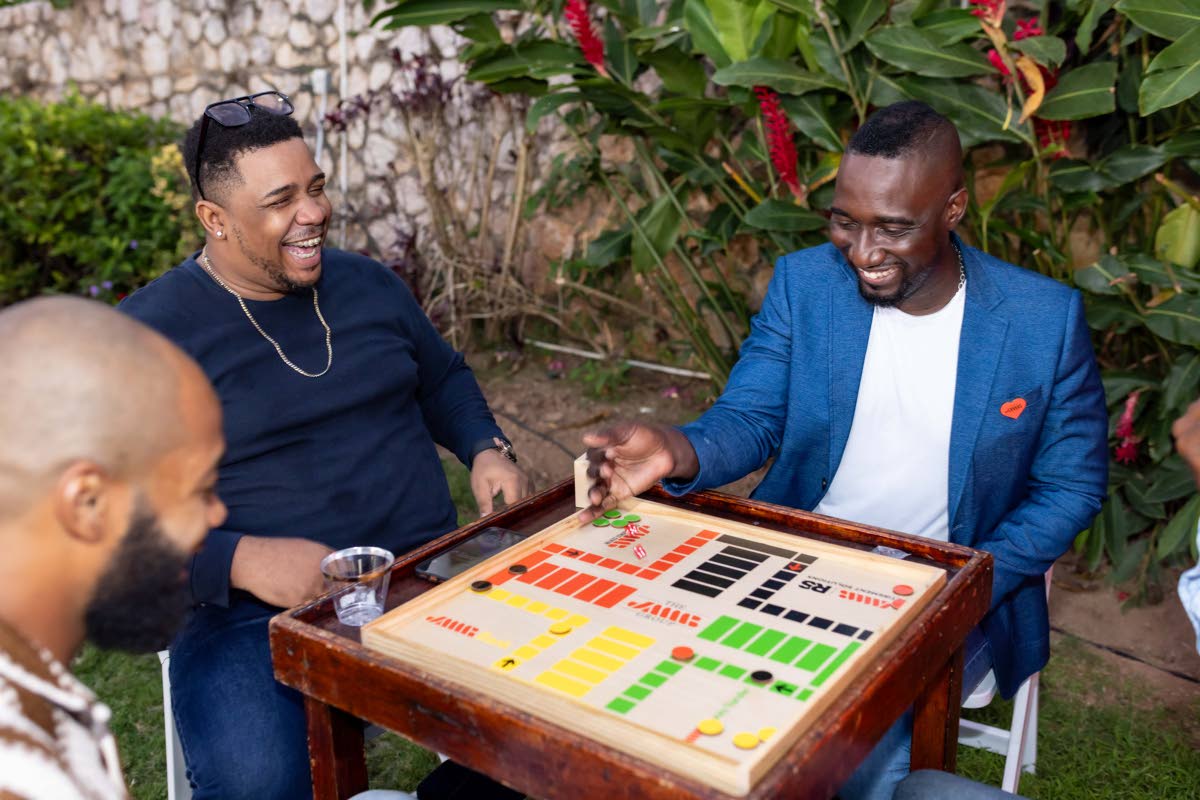 It was an evening of good vibes, great energy, and genuine connection as Mark McKenzie (right), SME relationship manager, JMMB Bank; Earl McDonald of VL BPO Limited, and Jordan Wright (left) of SJOJ Limited, enjoy a game of Ludo.