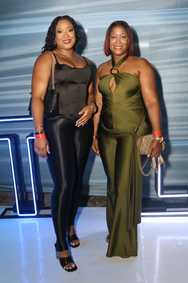 Equipment dispatcher Kadian Samuels (left) and her sister Jeanelle show that sisters make the best party dates.