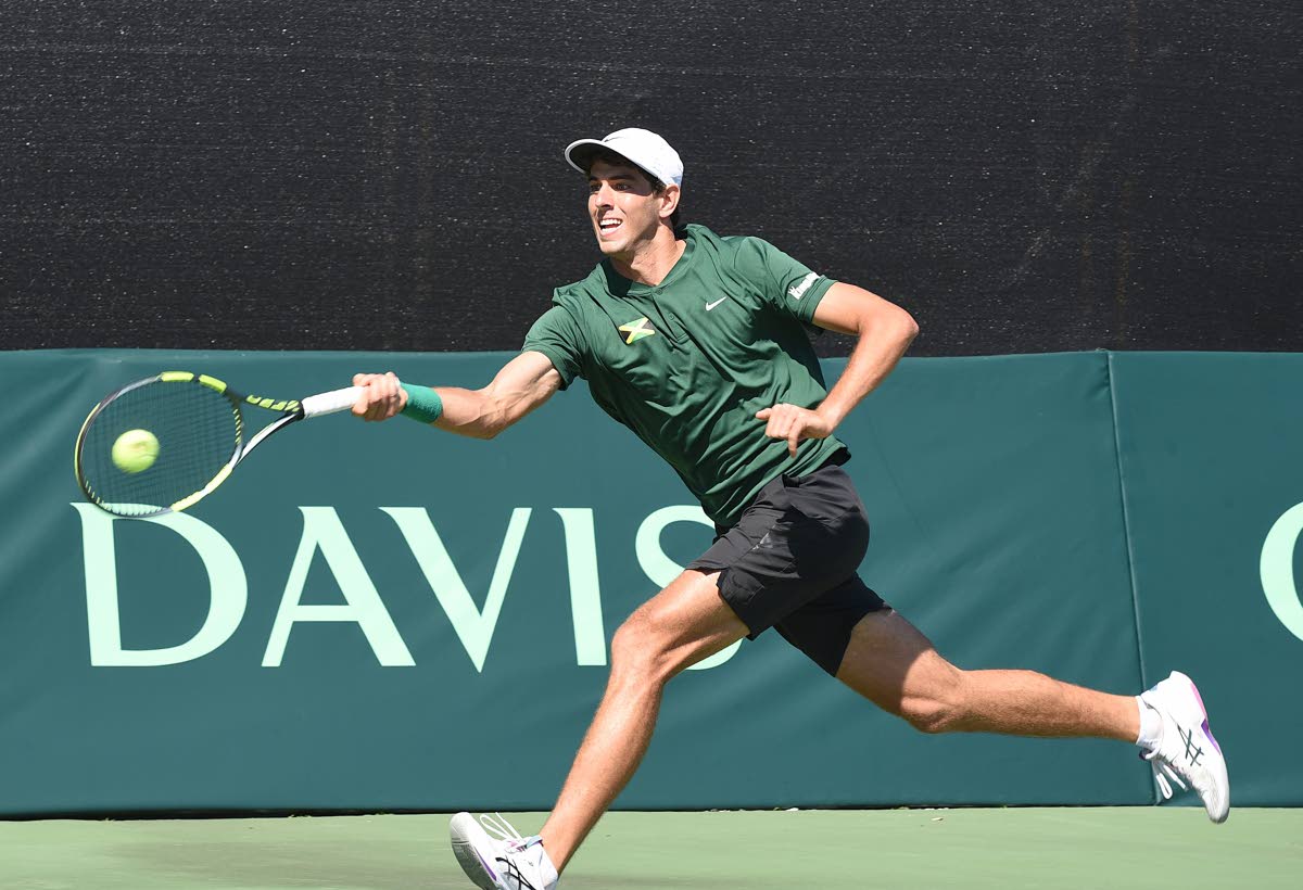 Jamaica’s Blaise Bicknell stretches for a return during his Davis Cup Group II singles tennis match against Uruguay’s Cardozo Aguilar at the Liguanea Club in New Kingston yesterday.