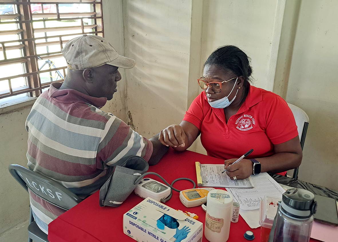 Dujan Hutchinson undergoes a vital check conducted by a volunteer.