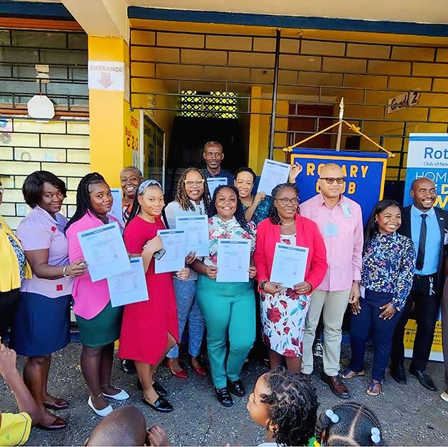 Teachers of the Constant Spring Primary and Infant School proudly pose with their certificates of participation in the Heartsaver CPR AED Programme.