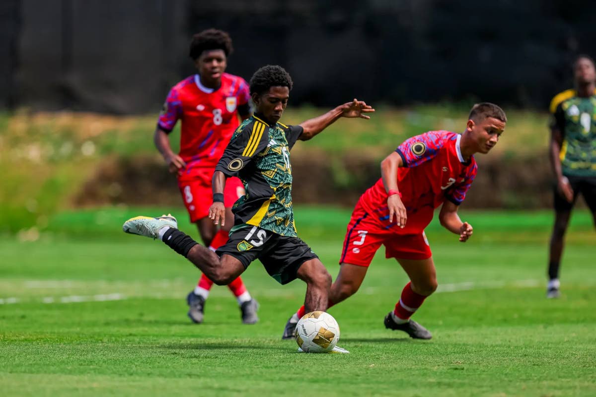 Jamaica’s Rajon McKenzie gets ready to kick a ball during a Concacaf Under-17 Qualifier against the Cayman Islands on Sunday. McKenzie scored during the 12-0 win for the Jamaicans.