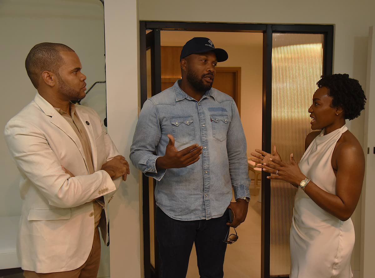 Co-founders of FUTURE Medical and Aesthetics Dr Marcus Lee (left), functional integrative physician, and Dr Mariesha Terrelonge Lee, aesthetic laser and regenerative physician, engage in conversation with Agent Sasco (centre).