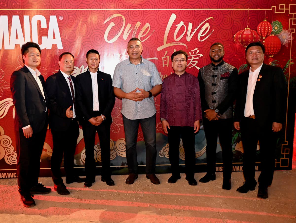 Members of the Chinese community out of western Jamaica with Prime Minister Dr Andrew Holness (centre) and Mayor of Montego Bay Richard Vernon (second right) during the Chinese New Year event in Montego Bay on Sunday.