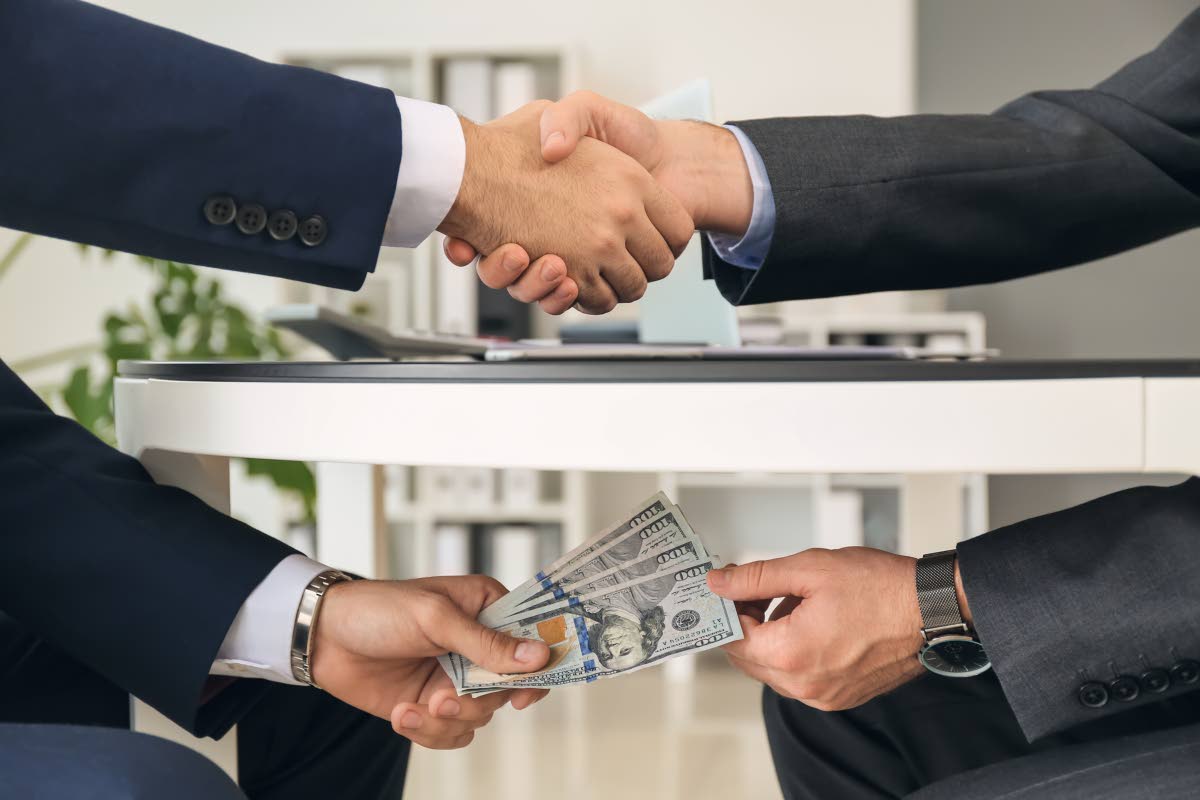 Representational image of bribing.
