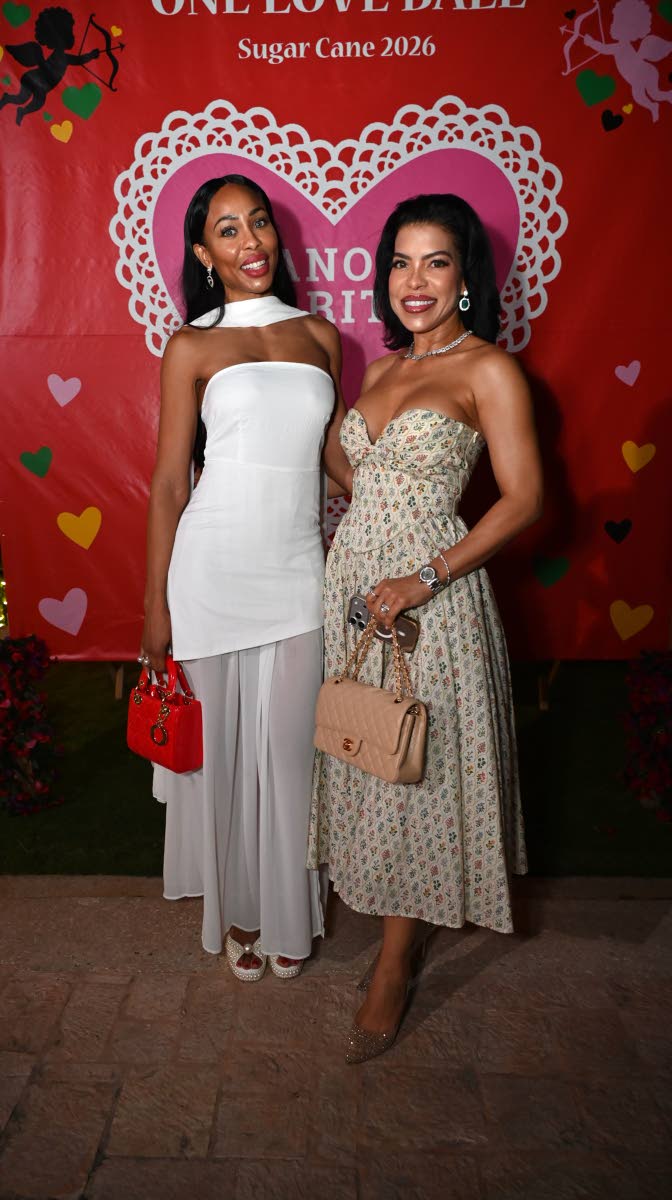All dressed up in white with a pop of red is Michelle Vernon (left) and Tanisa Samuel Hofer, in a strapless dress from Flawless Boutique by Monique, paired with a Chanel bag.