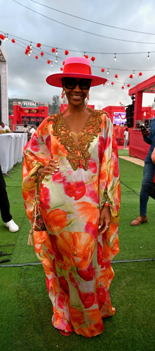 We can’t help, but stop and stare at Angelie Spencer, wearing a patterned floor-length kaftan paired with a wide-brim fedora.
