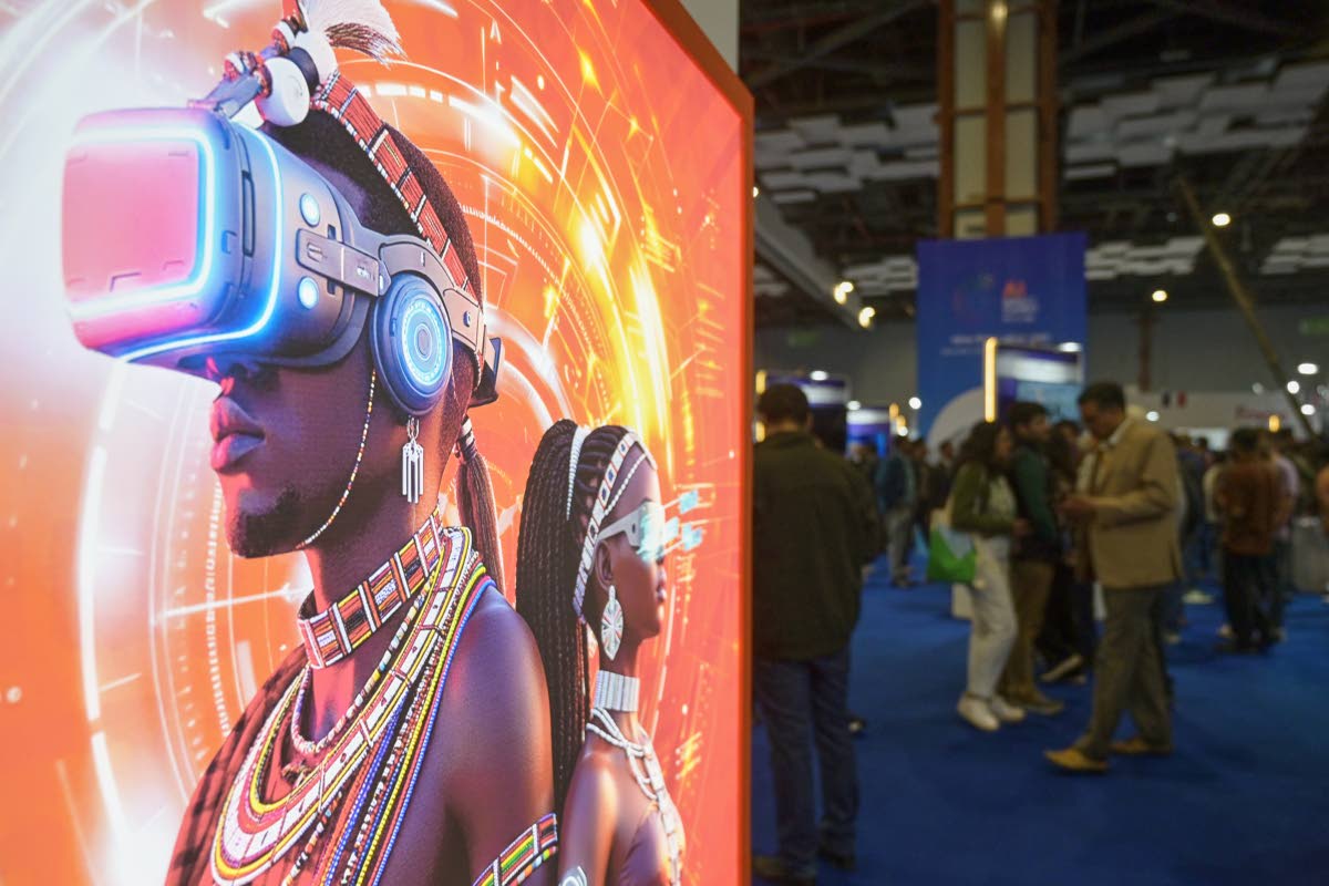 
Visitors stand next to an advertising billboard at AI summit in New Delhi, India.