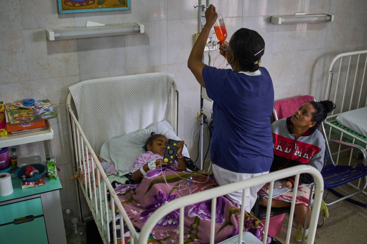 Carolina Silva Matos, a cancer patient, rests in a hospital bed at the National Institute of Oncology and Radiology in Havana, Cuba, on Friday.