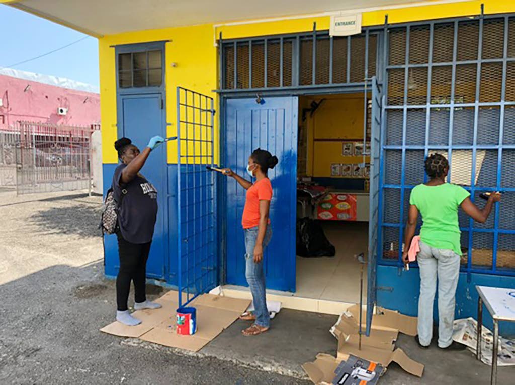 PWD Co-operative Credit Union team members in action, painting the exterior of Bethany Early Childhood Development Centre on December 30, 2025, following the credit union’s adoption of the school.