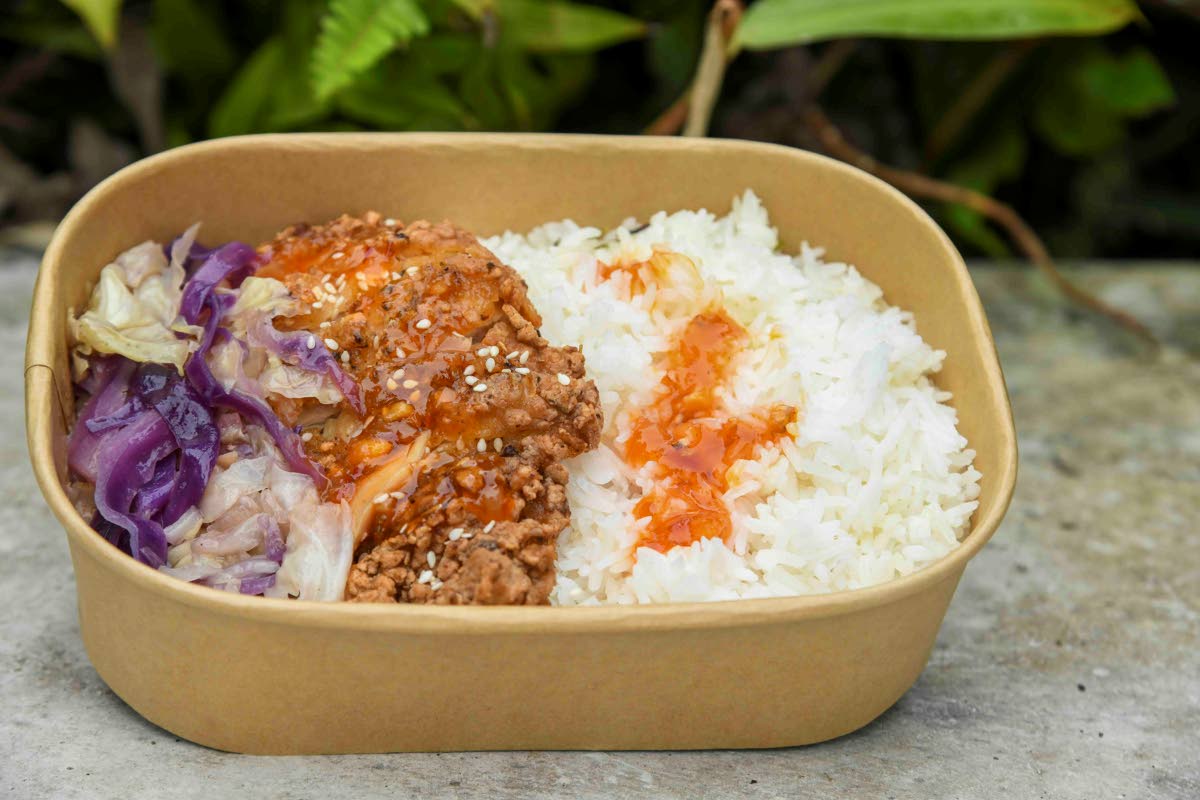 Homemade buttermilk-marinated chicken, lightly fried with subtle island spices, served with jasmine rice and vegetable slaw.  