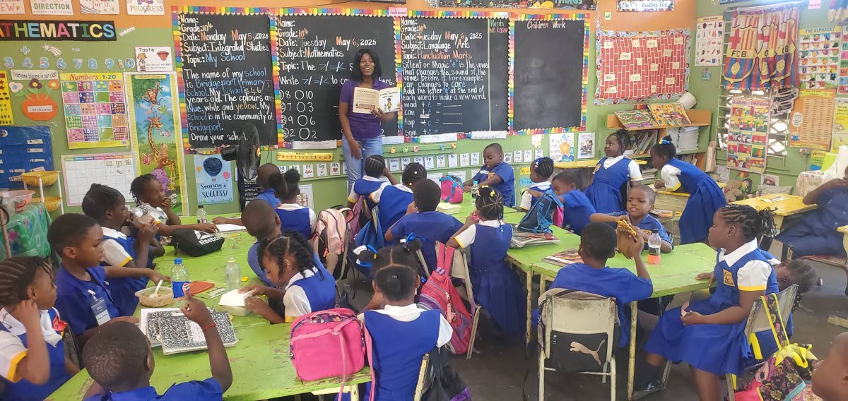 Franceta Lopez, the writer of seven children’s books, reading to students at Bridgeport Primary School in St Catherine last year. 