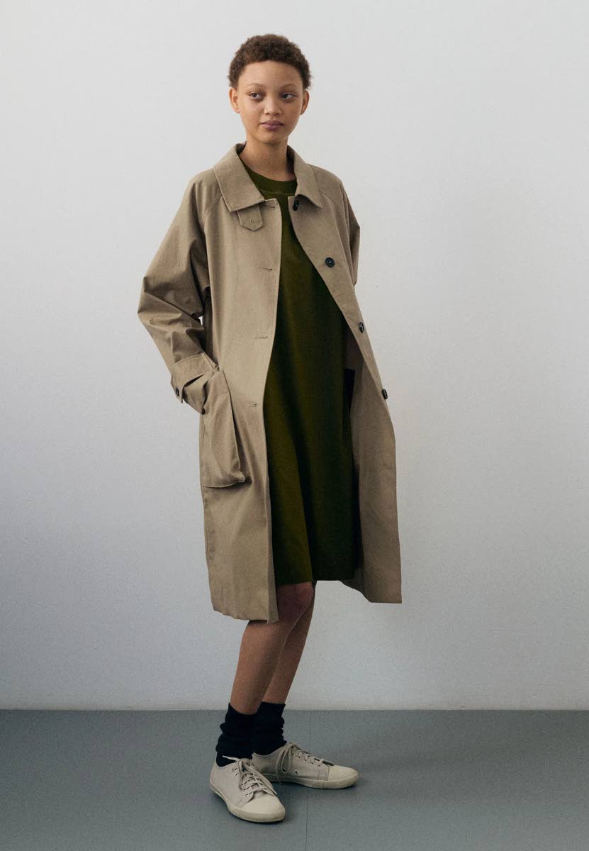 The MHL Railway Mac dry cotton canvas raincoat is teamed with a relaxed T-shirt dress. 