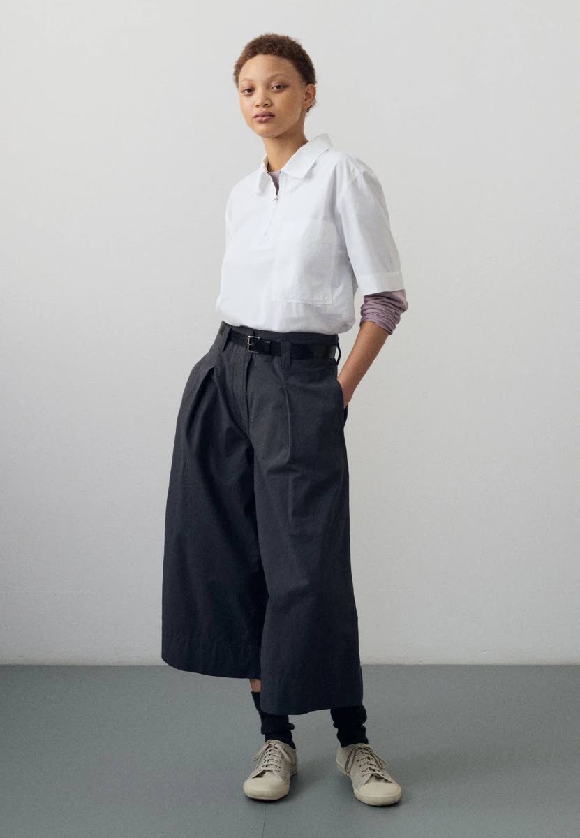 Dill in the MHL by Margaret Howell raglan crew-neck t-shirt, half-zip shirt, soft bridle belt, and wide-leg culottes. 