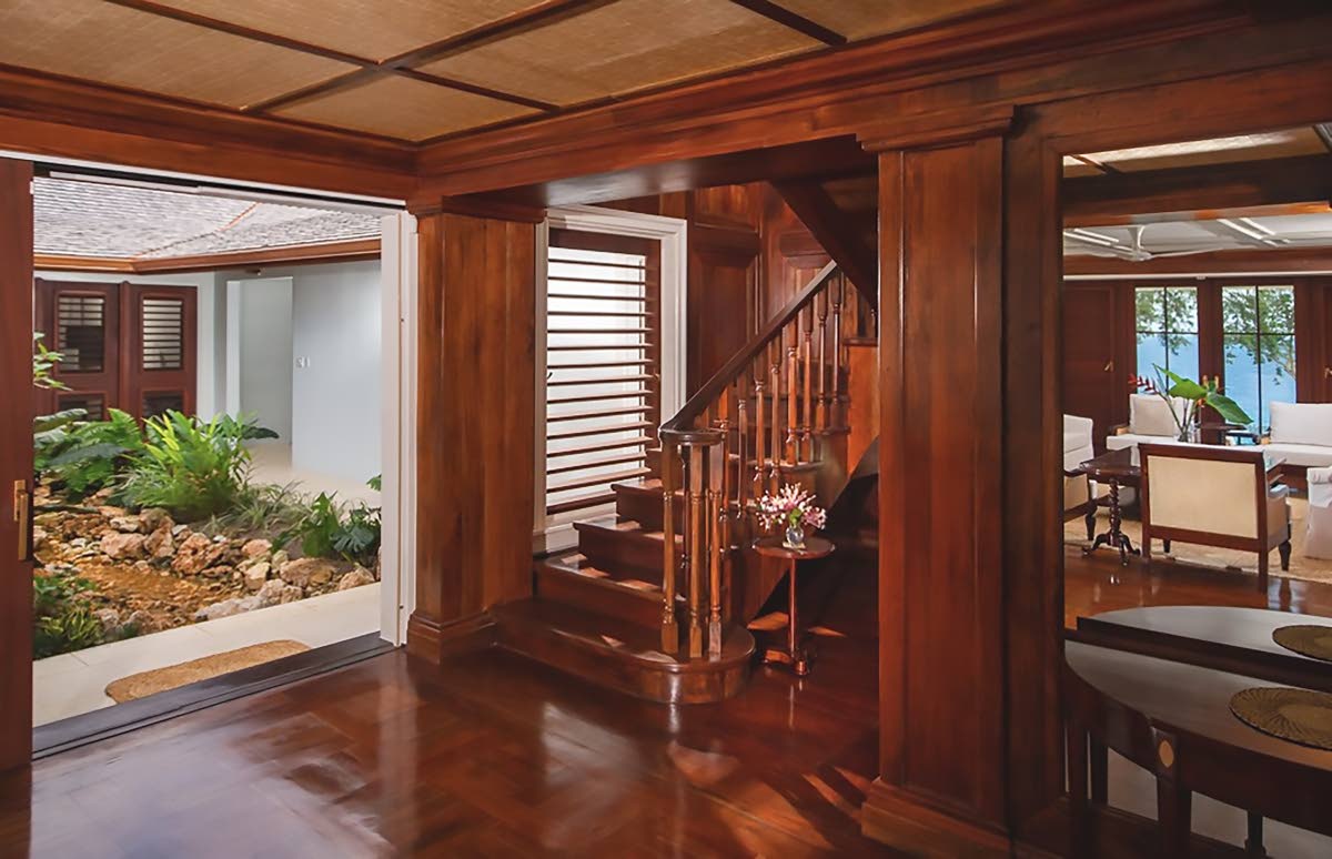 The layout wows with two separate, open-air garden courtyards at the centre of the home.