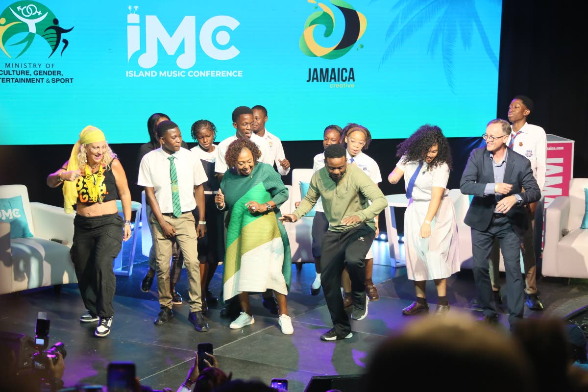 
Minister of Culture, Gender, Entertainment and Sport Olivia Grange challenged students to a dance-off on stage during the opening of the Island Music Conference on Wednesday. 