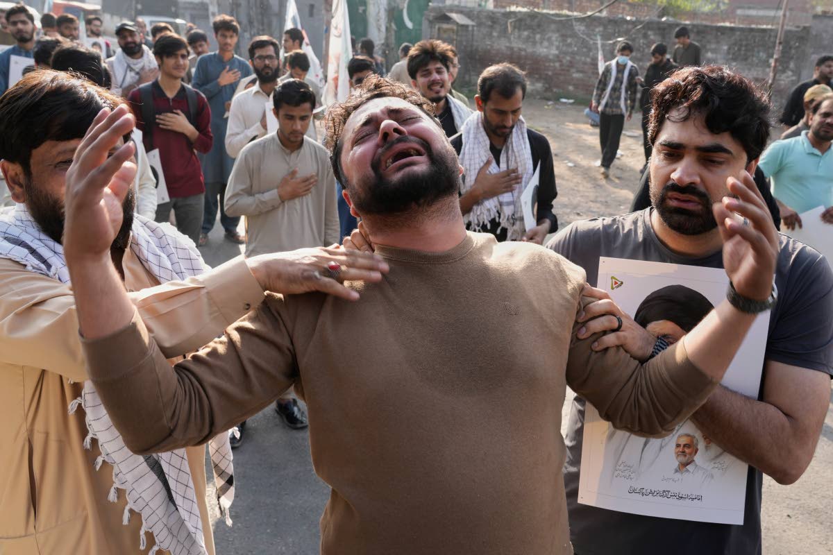 Shiite Muslims mourn the death of Iranian Supreme Leader Ayatollah Ali Khamenei during a protest against the US and Israel in Lahore, Pakistan.