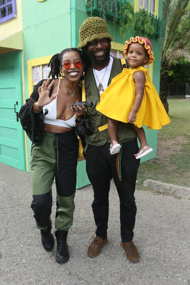 Fashion designer and owner of Quaint Bags Gabrielle Clarke enjoys a family outing with Andre Gayle and their bundle of joy, baby LuLu Gayle.