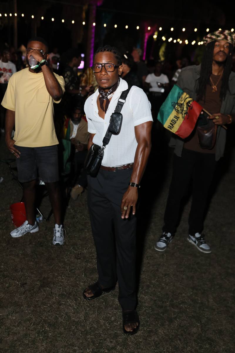 Chef Oshane Warren completes his festival look with a scarf and Louis Vuitton messenger bag. 