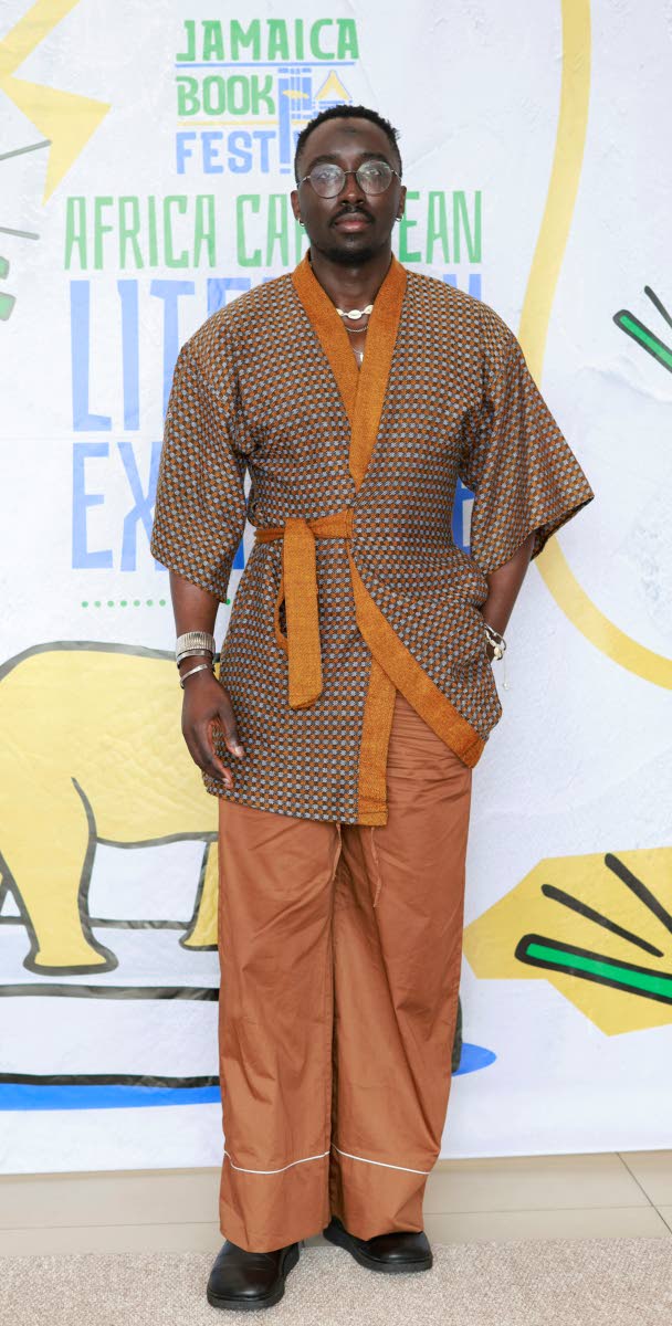 Troy Onyango, a London-based Kenyan writer and the founder of Lolwe, a Pan-African literary and arts magazine, reps the continent in an African tunic and matching trousers.