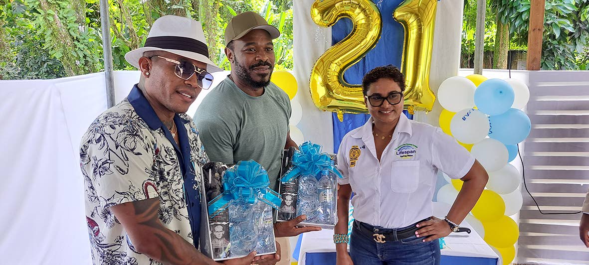 CEO of Lifespan Nayana Williams stands with brand ambassador Olaf Blackwood (left) and Lyriq Bent (centre), a Jamaican‑born Hollywood actor.