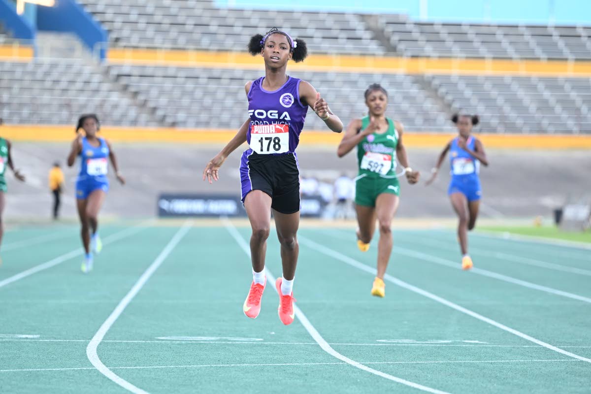 Photos by Gladstone Taylor/Multimedia Photo editor 
Foga Road’s Shameika McLean runs away with the under-17 girls’ 400 metres at the Carifta Trials inside the National Stadium yesterday.