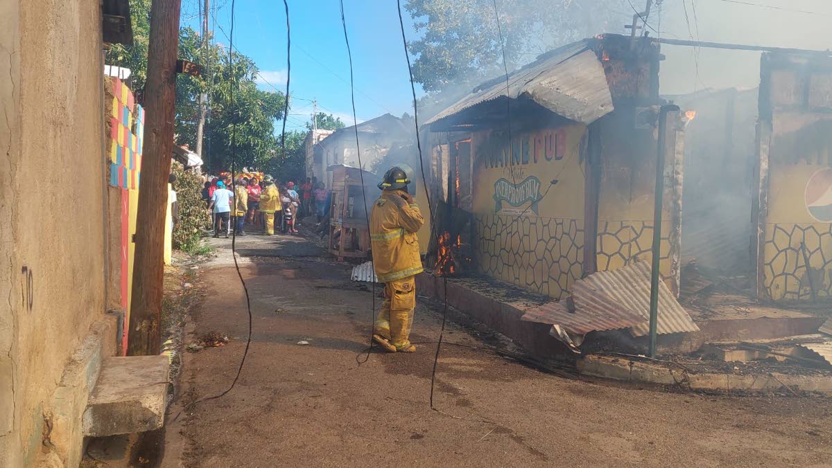 Firefighters at the scene of a fire in Craig Town, St Andrew on March 8, 2026.