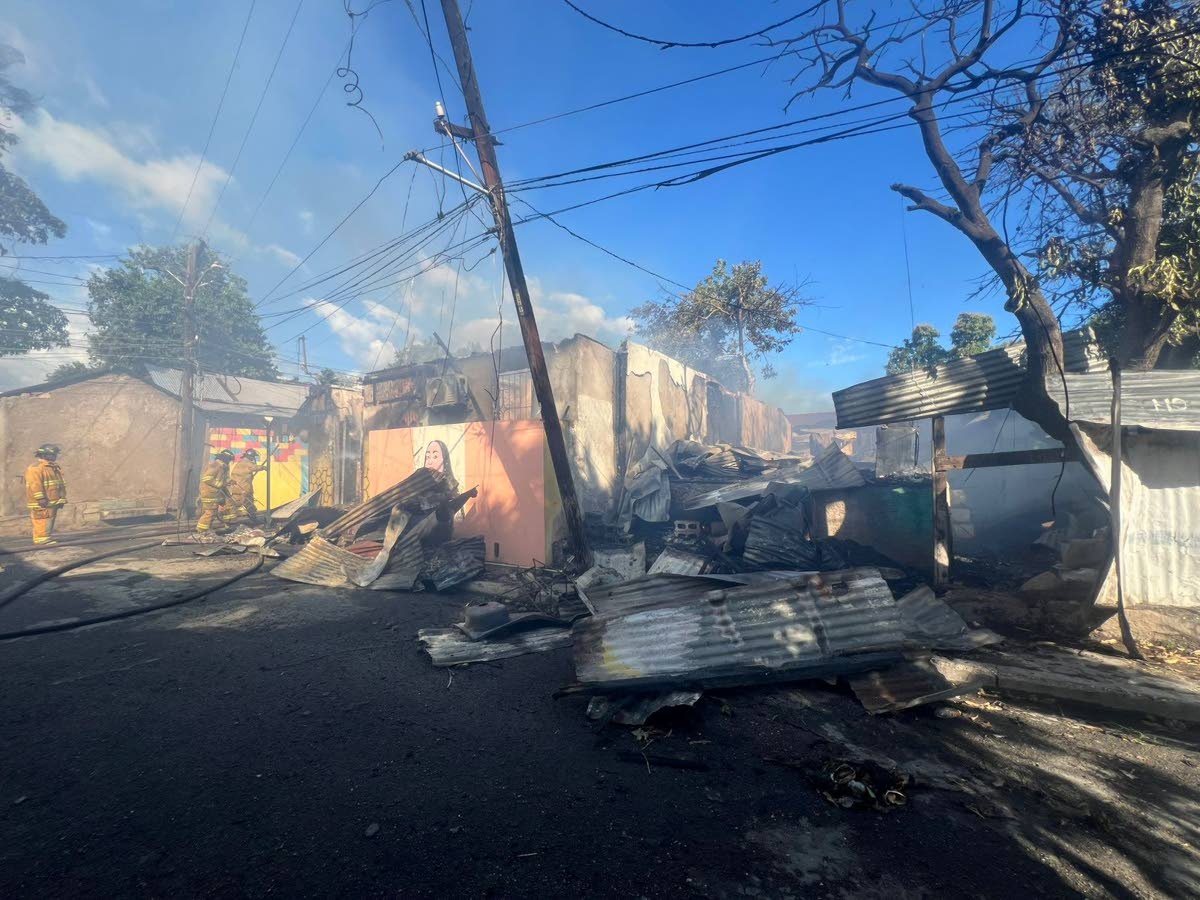 Firefighters at the scene of a fire in Craig Town, St Andrew on March 8, 2026.