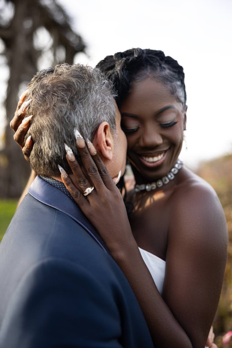 A tender moment as William holds his bride, Lisa-Gaye, close.
