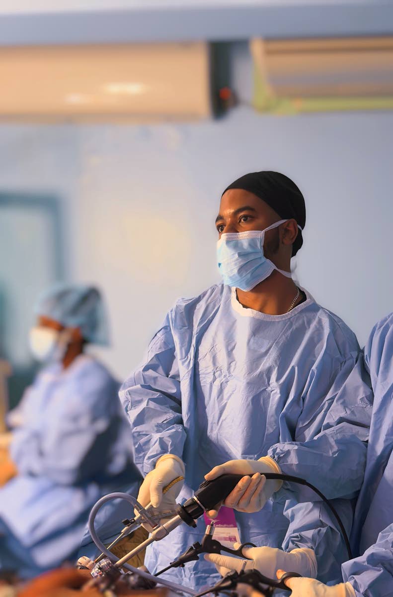 Dr O’Rane Thomas, lead surgeon performs the first laparoscopic colectomy at the Medical Associates Hospital.