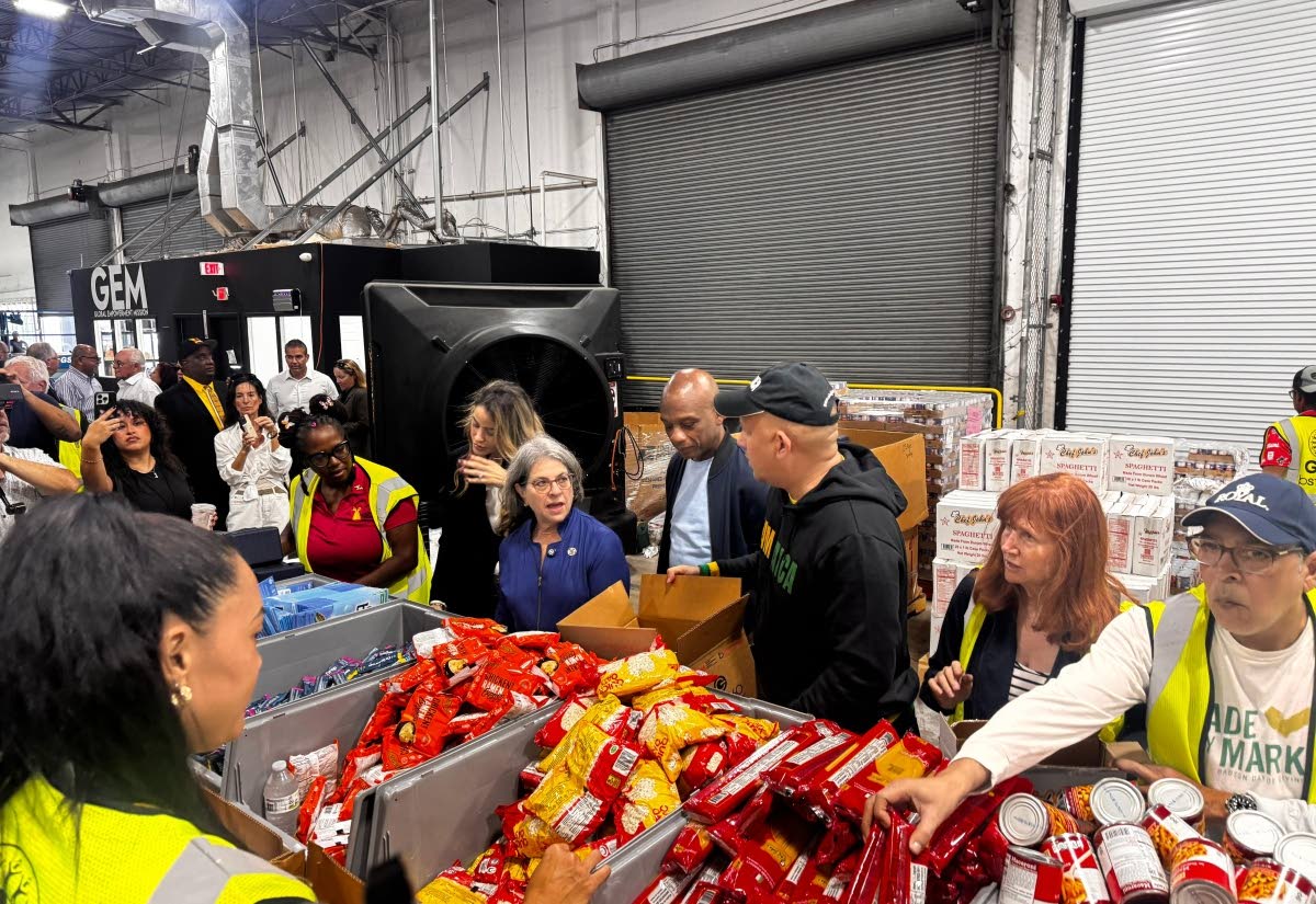 Global Empowerment Mission team members prepare relief supplies to send to Jamaica. 
