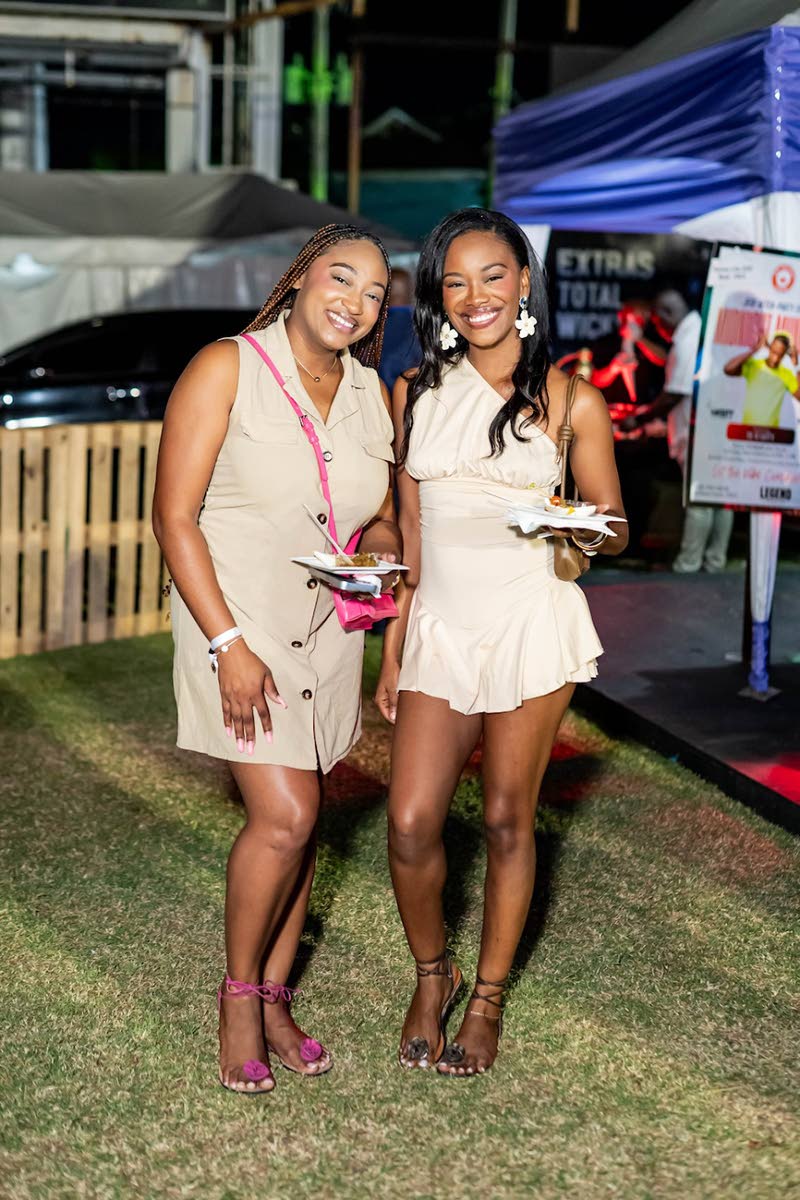 Jameika Johnson, public relations officer, and Velonique Bowen, public relations manager, enjoy the culinary fare on offer at Decade 2.0.