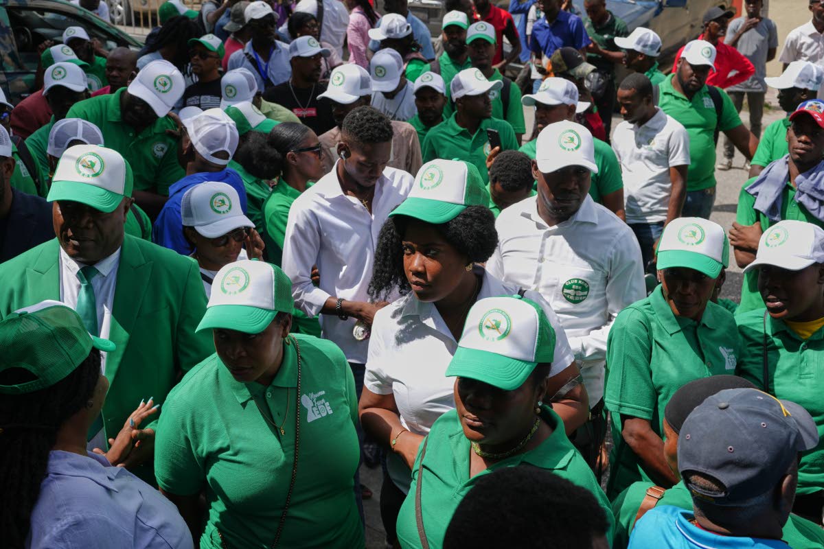 Members of the EDE (Committed to Development) political party arrive to register the party at the Provisional Electoral Council in the Petion-Ville neighborhood of Port-au-Prince, Haiti on March 12, 2026. (AP Photo/Odelyn Joseph)