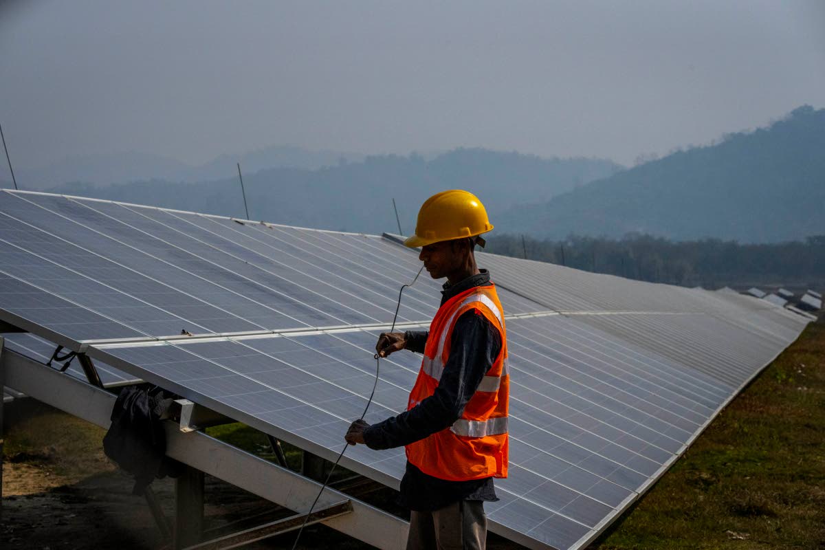 A man working at a solar power plant.