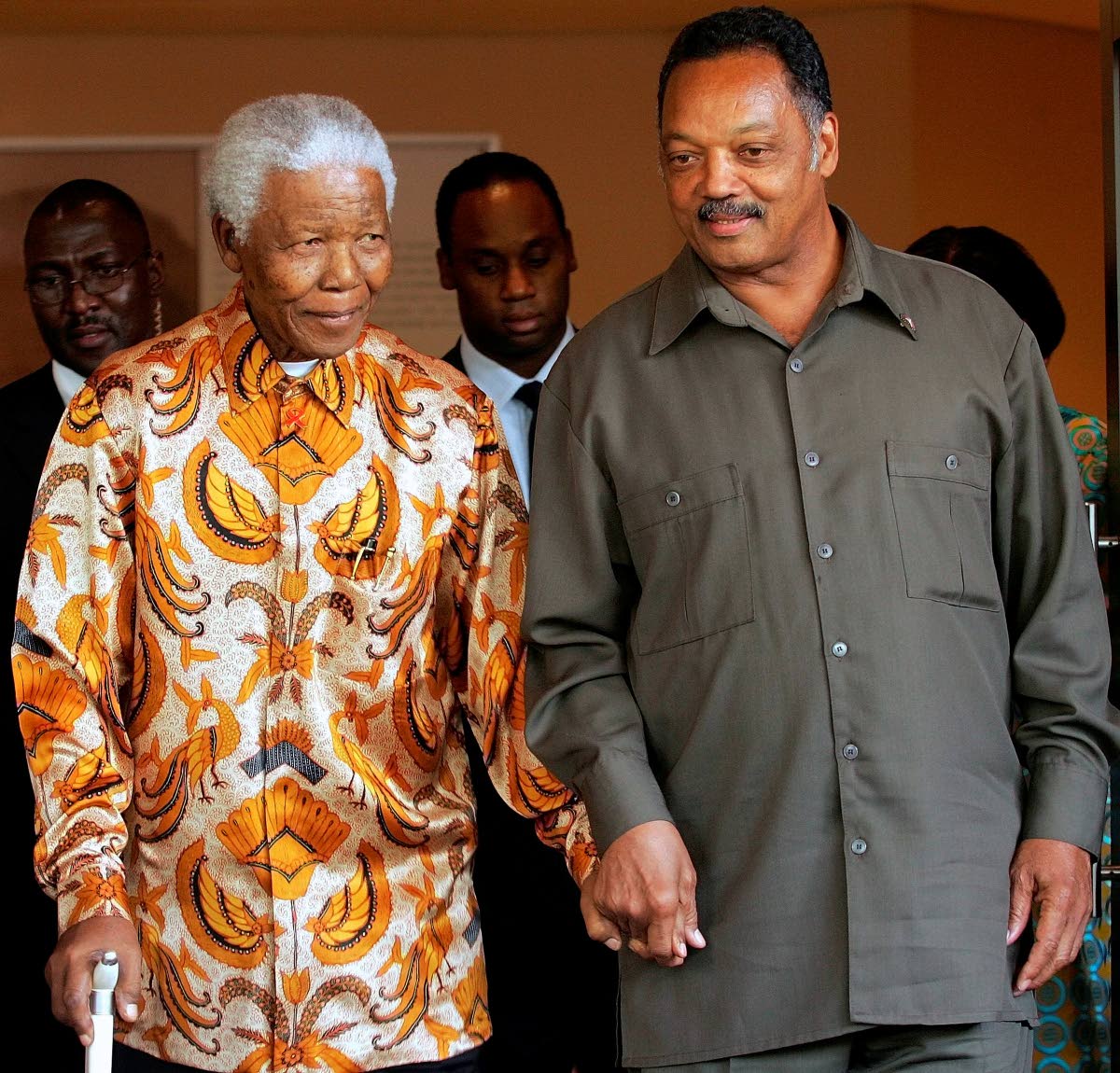 Nelson Mandela, left, walks with the Rev. Jesse Jackson after their meeting in Johannesburg, South Africa, in October 2005.