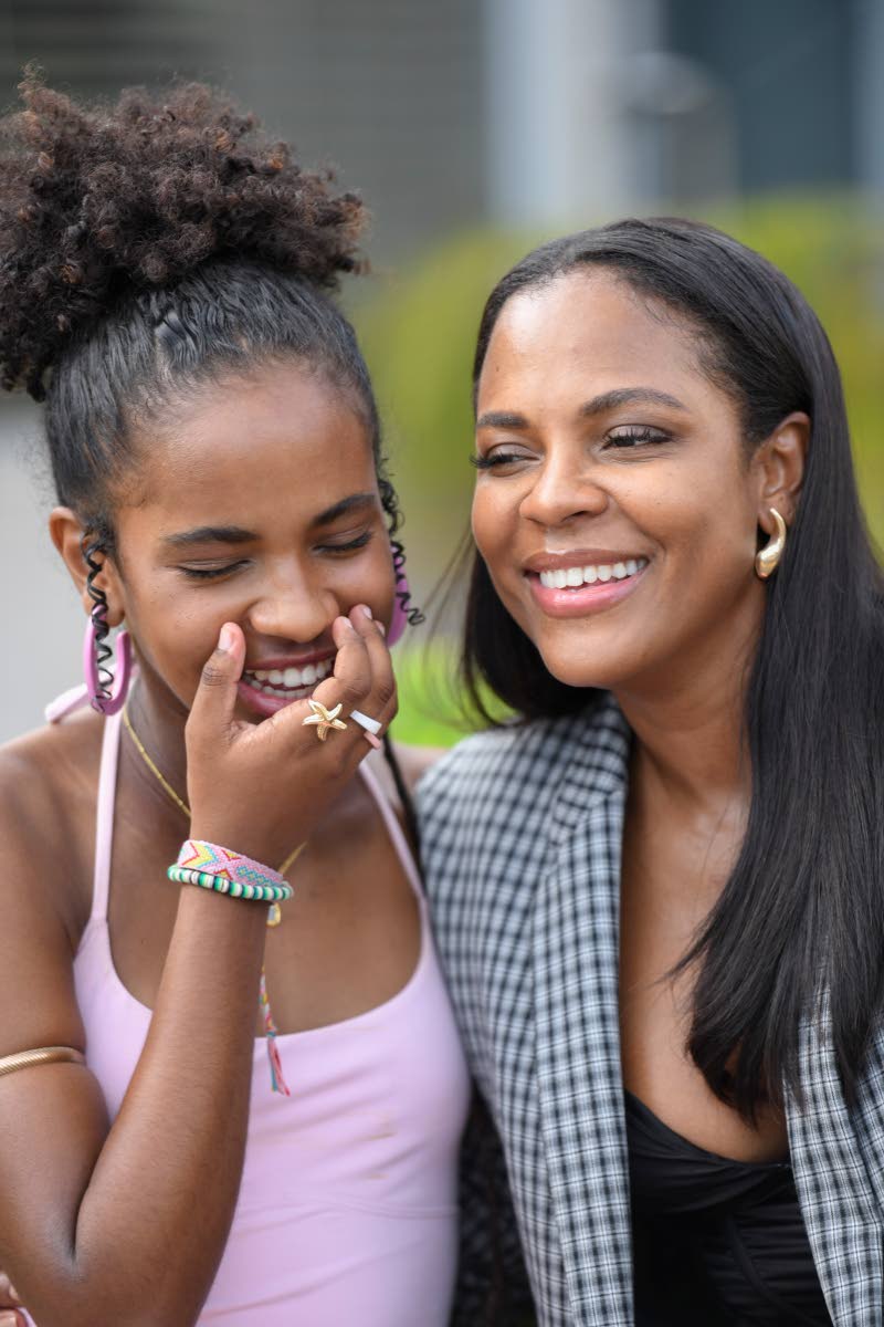 Photos by Antoine Lodge/Photographer 
Fashion designer and stylist Kaysian Wilson shares a light moment with her daughter, Jazzmine Bourke. Wilson reminds her that confidence is the most beautiful thing she can wear.