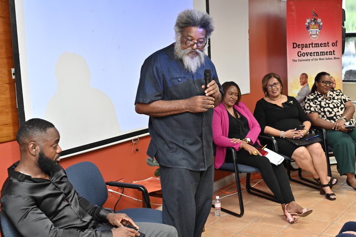 Dr Louis Moyston (second left), lecturer in the Department of Government at The University of the West Indies, Mona Campus,  speaks on ‘The resurgence of US Imperialism in the Region: Target Cuba’ while looking on (from left) are co-speakers Damion Gor