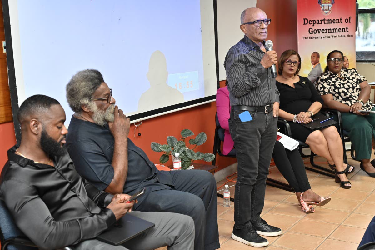 Professor Trevor Munroe (centre) addresses the seminar. 