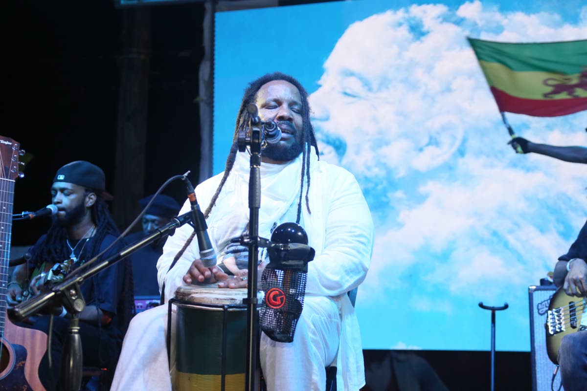 Stephen Marley performs during the tribute concert for his son Joseph ‘Jo Mersa’ Marley at the Bob Marley Museum in St Andrew, with an image of the late reggae artiste displayed behind him.