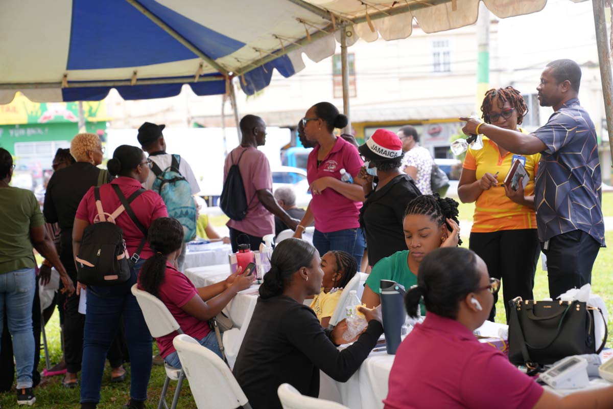 Scores of people take advantage of free health checks during activities at the health fair in Manchester.